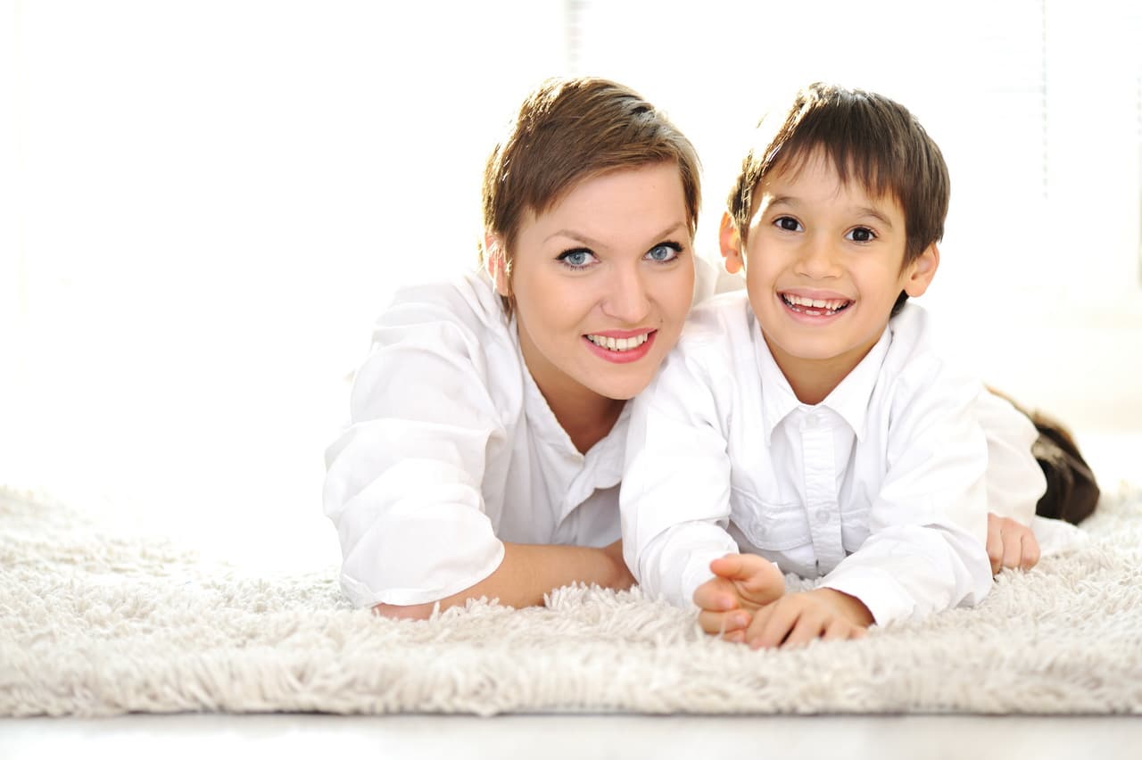 Family Portrait Of Mother And Son At Home