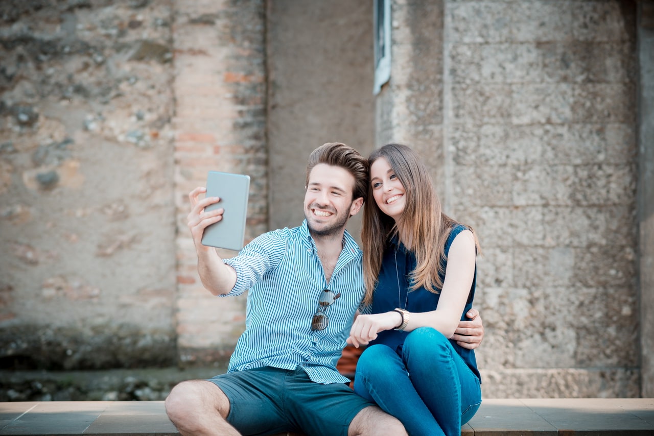 Young Beautiful Couple Lovers Using Tablet