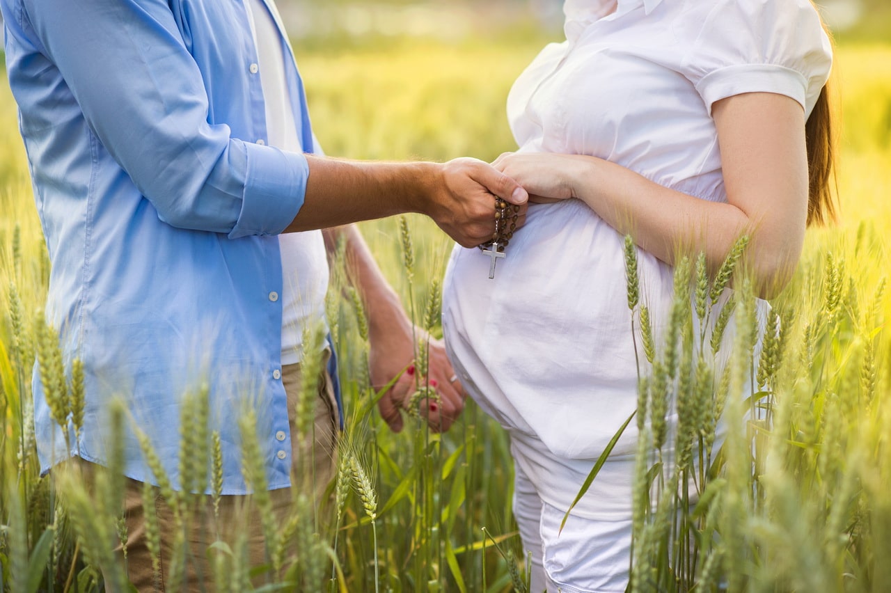 Pregnant Couple Praying