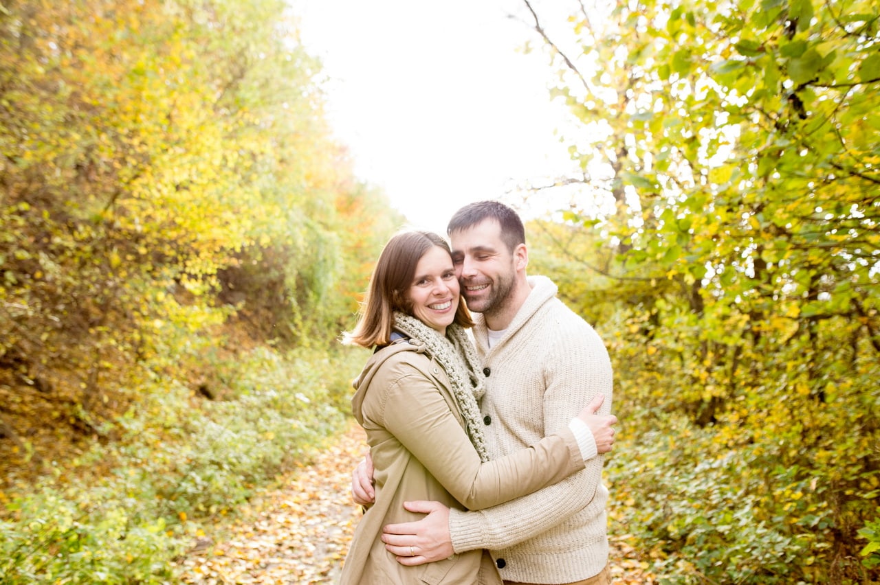 Beautiful Young Couple On A Walk In Colorful Autumn Nature.